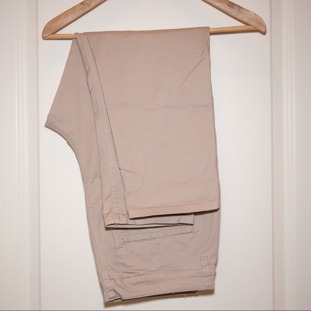 Tan chinos with cropped hem and dropped crotch.